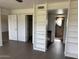 View of bedroom with built-ins, ensuite bath, and tiled flooring at 7800 E Lincoln Dr # 2047, Scottsdale, AZ 85250