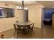 Bright dining area with a round table and four chairs, open to the kitchen at 7800 E Lincoln Dr # 2047, Scottsdale, AZ 85250