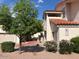 Exterior view of a well-maintained condo building with vibrant landscaping at 7800 E Lincoln Dr # 2047, Scottsdale, AZ 85250