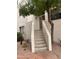 Exterior shot of the building with staircase leading to an upper level, desert style plants at 7800 E Lincoln Dr # 2047, Scottsdale, AZ 85250