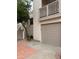 Exterior shot of the building with a one-car garage and side staircase covered in red rock at 7800 E Lincoln Dr # 2047, Scottsdale, AZ 85250
