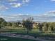 Scenic view of a golf course with mountain backdrop, trees and beautiful blue sky at 7800 E Lincoln Dr # 2047, Scottsdale, AZ 85250