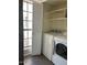 Functional laundry room with a washer, dryer, and shelving at 7800 E Lincoln Dr # 2047, Scottsdale, AZ 85250