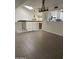 Bright, tiled living room with high ceilings, skylight, and staircase at 7800 E Lincoln Dr # 2047, Scottsdale, AZ 85250