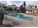 Inviting community pool with lounge chairs in a well maintained residential community at 7800 E Lincoln Dr # 2047, Scottsdale, AZ 85250