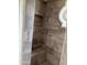 Shower featuring built in bench, stone accents, and tile walls at 7800 E Lincoln Dr # 2047, Scottsdale, AZ 85250