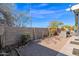 Backyard view with gravel, landscaping, and AC unit at 8500 E Southern Ave # 538, Mesa, AZ 85209