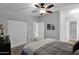 Comfortable bedroom with ceiling fan, double doors, and ensuite bathroom access at 8500 E Southern Ave # 538, Mesa, AZ 85209