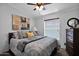 Guest bedroom with queen-size bed, dresser, and window coverings at 8500 E Southern Ave # 538, Mesa, AZ 85209