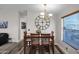 Bright dining area with wood table and chandelier at 8500 E Southern Ave # 538, Mesa, AZ 85209