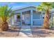 Mobile home with a covered porch and desert landscaping at 8500 E Southern Ave # 538, Mesa, AZ 85209