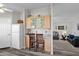 Open kitchen with breakfast bar, granite countertops, and view into living room at 8500 E Southern Ave # 538, Mesa, AZ 85209