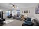 Living room featuring gray couches and ceiling fan at 8500 E Southern Ave # 538, Mesa, AZ 85209