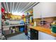 Well-equipped workshop with workbench, storage shelves, and various tools at 8500 E Southern Ave # 538, Mesa, AZ 85209