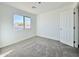 Bright bedroom with neutral walls and carpet at 10073 W Mission Dr, Arizona City, AZ 85123