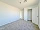 Spacious bedroom with neutral carpeting and closet at 10073 W Mission Dr, Arizona City, AZ 85123