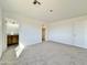 Bright bedroom with gray carpet, and view of bathroom at 10073 W Mission Dr, Arizona City, AZ 85123