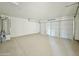 Bright and spacious garage with two-car capacity and ample storage space at 10073 W Mission Dr, Arizona City, AZ 85123