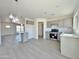 Open concept kitchen with gray cabinets, white countertops, and island at 10073 W Mission Dr, Arizona City, AZ 85123