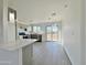 Modern kitchen with gray cabinets, white countertops, and island at 10073 W Mission Dr, Arizona City, AZ 85123