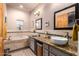 Bathroom with double vanity and soaking tub at 10283 E Fortuna Ave, Gold Canyon, AZ 85118