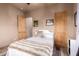 Charming bedroom with a cozy bed and wood door at 10283 E Fortuna Ave, Gold Canyon, AZ 85118