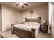 Bedroom with wood bed frame and ceiling fan at 10283 E Fortuna Ave, Gold Canyon, AZ 85118