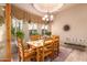 Charming dining room with wood table at 10283 E Fortuna Ave, Gold Canyon, AZ 85118