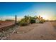 Landscaped front yard with drought-tolerant plants and a rock border at 10283 E Fortuna Ave, Gold Canyon, AZ 85118