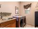 Convenient laundry room with washer, dryer, and sink at 10283 E Fortuna Ave, Gold Canyon, AZ 85118