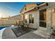 Spacious patio adjacent to the pool, featuring a table and chairs for outdoor enjoyment at 10283 E Fortuna Ave, Gold Canyon, AZ 85118