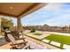 Covered patio overlooking a pool and mountain views at 11065 E Mark Ln, Scottsdale, AZ 85262