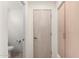 Simple bathroom with toilet and access to another room at 11065 E Mark Ln, Scottsdale, AZ 85262