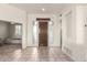 Bright and airy entryway with tile flooring and a modern door at 11065 E Mark Ln, Scottsdale, AZ 85262