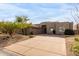 Single-level home with a two-car garage and desert landscaping at 11065 E Mark Ln, Scottsdale, AZ 85262