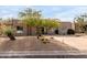 Stunning desert landscape enhances this single-level home's curb appeal at 11065 E Mark Ln, Scottsdale, AZ 85262