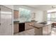 Bright kitchen with an island and a window overlooking the backyard at 11065 E Mark Ln, Scottsdale, AZ 85262