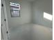 Bright bedroom with a window overlooking the neighborhood at 11446 E Utah Ave, Mesa, AZ 85212