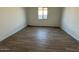 Simple bedroom with tile floors and a window at 11446 E Utah Ave, Mesa, AZ 85212