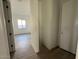 Hallway with tile floors leading to other rooms in the house at 11446 E Utah Ave, Mesa, AZ 85212