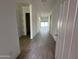 Bright hallway with tile flooring and access to other rooms at 11446 E Utah Ave, Mesa, AZ 85212