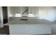 Large kitchen island with white quartz countertop at 11446 E Utah Ave, Mesa, AZ 85212