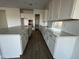 Modern kitchen with white cabinets and quartz countertops at 11446 E Utah Ave, Mesa, AZ 85212