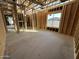 Unfinished bedroom with wood framing, and window at 11457 E Utopia Ave, Mesa, AZ 85212