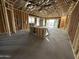 Unfinished living room with exposed framing and HVAC system at 11457 E Utopia Ave, Mesa, AZ 85212