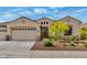 Beautiful single-story home with a landscaped front yard and attached two-car garage at 12803 W Campina Dr, Litchfield Park, AZ 85340