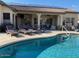 Stunning pool and patio area with plenty of seating at 12803 W Campina Dr, Litchfield Park, AZ 85340