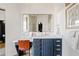 Modern bathroom with blue vanity and marble countertop at 13231 N El Pueblo Blvd, Fountain Hills, AZ 85268