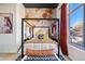 Stylish bedroom with a four-poster bed and large window at 13231 N El Pueblo Blvd, Fountain Hills, AZ 85268