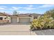 Single-story home with two-car garage and desert landscaping at 13231 N El Pueblo Blvd, Fountain Hills, AZ 85268